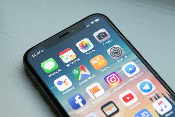 A smartphone ready to send a WhatsApp booking message